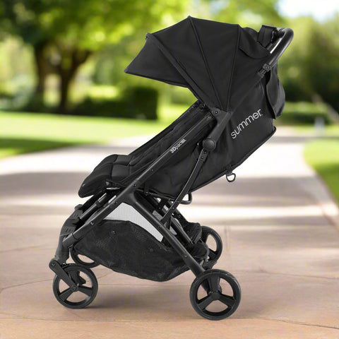 Summer Infant 3Dpac CS+ double stroller in black with car seat compatibility and large canopies
Compact lightweight double stroller with two seats and peekaboo windows
Black twin stroller folded for easy transport
Close-up of stroller seat recline and under-storage basket