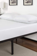 Queen size metal bed frame with mattress in minimalist white bedroom