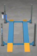 Blue 4-post car lift in a workshop setting

Top-down view of the HFL4065E vehicle lift

Vehicle raised on blue 4-post lift

Hydraulic-powered truck lift hoist

Portable heavy-duty automotive lift with ramps