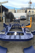 22 ft 4-tower hydraulic frame puller machine for professional collision repair. Heavy-duty frame puller with steel platform and anchoring clamps.  10-ton hydraulic tower on autobody frame straightening system