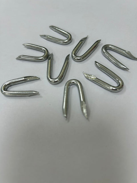 30-pound box of galvanized U-nail fence staples for wood posts
Heavy-duty wire fence staples with hot-dipped galvanized finish
Close-up of sharp tip U-shaped fencing nails for farm use
Fence hardware staples bulk packaging for wire and netting
