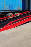 Adjustable dock height ramp at warehouse bay