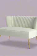 Fuchsia velvet loveseat with tufted back and gold legs in modern decor.
Ivory armless loveseat sofa with mid-century design in studio setup.
Tan velvet 2-seater with flared gold legs styled against a neutral wall.
Close-up of plush velvet texture and fluted backrest detail.
Color swatches displaying Fuchsia, Pink, Ivory, and Tan options.