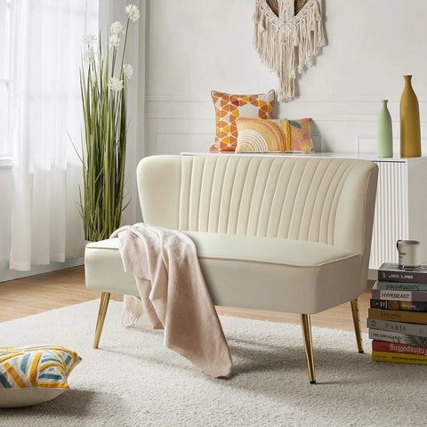 Fuchsia velvet loveseat with tufted back and gold legs in modern decor.
Ivory armless loveseat sofa with mid-century design in studio setup.
Tan velvet 2-seater with flared gold legs styled against a neutral wall.
Close-up of plush velvet texture and fluted backrest detail.
Color swatches displaying Fuchsia, Pink, Ivory, and Tan options.