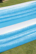Bestway 54009 inflatable paddling pool with kids
Top view of family in Bestway 10ft blue pool
Bestway family pool in outdoor garden setup
Spacious inflatable pool for backyard fun
Bestway 54009 kids pool with drain valve