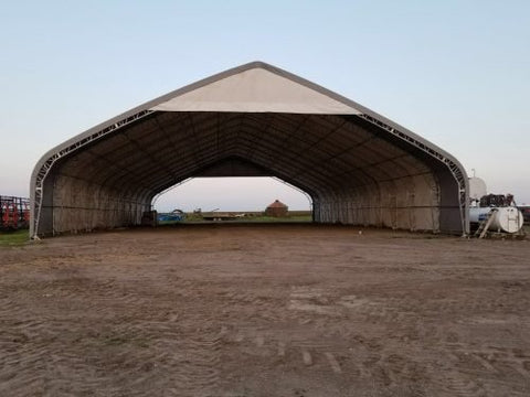 70′ WIDE DOUBLE TRUSS STORAGE BUILDINGS - with Standard 70X150X28 26.5 OZ PVC Cover | Sold by Uncle Wiener's Wholesale