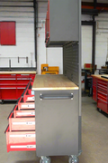 Red 17-drawer rolling tool chest with workbench top
Heavy-duty garage tool cabinet with rubberwood work surface
Industrial mobile workbench with 15 smooth-glide drawers
Garage storage cabinet with aluminum handles and locking system