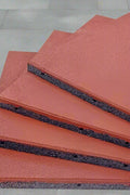 Interlocking red rubber patio tile close-up

20x20 rubber tile stacked set – top view

Playground flooring tile – angled corner

Red rubber tiles for outdoor use

Rubber tile texture – slip-resistant surface