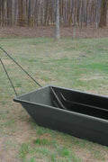 Heavy-duty black utility sled for winter outdoor hauling
Plastic hunting sled with tow rope and rugged HDPE build
Side view of winter snow sled for gear and firewood transport