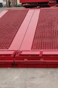 Heavy-duty equipment loading ramp with forklift clearance