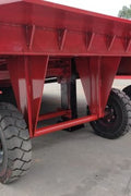 Red industrial dock ramp with steel traction grating