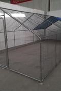 10x20 metal dog kennel cage with chicken wire fence

Walk-in outdoor animal enclosure for chickens or dogs

Backyard fenced compound with metal frame

Secure livestock pen with galvanized steel construction

Versatile pet and poultry cage outdoors