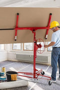 Drywall panel hoist in construction site lifting sheet to 11 ft ceiling

