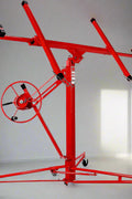 Red 11 ft drywall lift with crank hoist, rotating cradle, and caster wheels