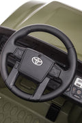 Olive green Toyota-style ride-on pickup truck for kids

Side view of remote-control kids truck with leather seat

Child’s electric ride-on truck with LED headlights

Toyota ride-on truck in olive green with suspension

Battery-powered pickup truck for toddlers