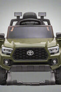 Olive green Toyota-style ride-on pickup truck for kids

Side view of remote-control kids truck with leather seat

Child’s electric ride-on truck with LED headlights

Toyota ride-on truck in olive green with suspension

Battery-powered pickup truck for toddlers