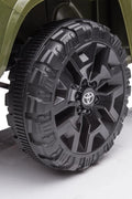 Olive green Toyota-style ride-on pickup truck for kids

Side view of remote-control kids truck with leather seat

Child’s electric ride-on truck with LED headlights

Toyota ride-on truck in olive green with suspension

Battery-powered pickup truck for toddlers