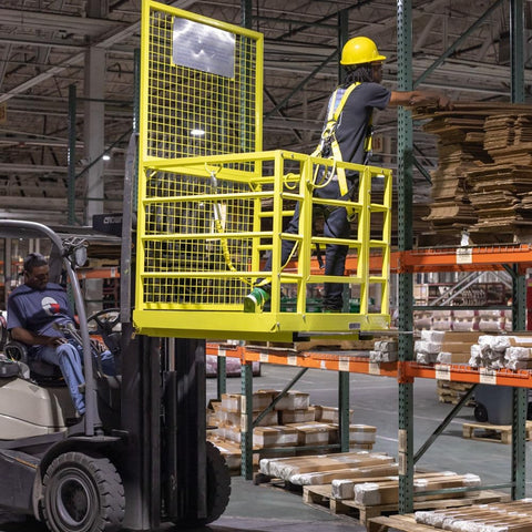 Yellow 2-person forklift safety cage with mesh floor

Forklift lifting steel work platform in industrial setting

OSHA-compliant safety cage with lockable gate

Close-up of forklift cage fork pockets and frame

Overhead maintenance platform for warehouse use