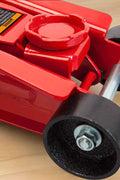 Big Red 2 Ton Hydraulic Floor Jack – Side View with Trolley Design
Low-Profile Hydraulic Jack – Compact Design for Cars and SUVs
Big Red Floor Jack in Action – Lifting Compact Vehicle