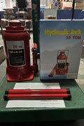 “Heavy-duty hydraulic bottle jack on steel platform”

“30-ton red bottle jack under truck”

“Close-up of 50-ton hydraulic jack with safety pin handle”