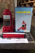 “Heavy-duty hydraulic bottle jack on steel platform”

“30-ton red bottle jack under truck”

“Close-up of 50-ton hydraulic jack with safety pin handle”