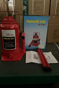 “Heavy-duty hydraulic bottle jack on steel platform”

“30-ton red bottle jack under truck”

“Close-up of 50-ton hydraulic jack with safety pin handle”