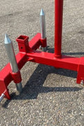 Red 3-point gooseneck hitch with bale spear mount
Tractor trailer hitch attachment with hay spear slots
Reinforced hitch frame for Conus 2 and Conus 1 spear placement
3-point trailer hitch attachment mounted on tractor
Spear holes and 2” trailer receiver on attachment frame