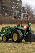 Black ballast box attachment on tractor for rear counterweight
Close-up of Category 1 3-point hitch ballast box
Ballast box filled and mounted on tractor for stability