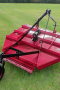 Red 6FT flail mower for tractor with PTO shaft
Flail mower showing blade assembly and rear roller
PTO connection and 3-point hitch pins
Heavy-duty rotary flail mower for pastures
Tractor using flail mower in a field (if available)