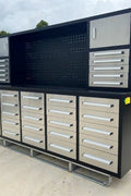 10 FT stainless steel workbench with 30 locking drawers
Heavy-duty garage tool storage cabinet with aluminum top
Industrial tool bench with black steel frame and red handles
30-drawer garage organizer with anti-slip liners and lockable drawers