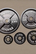 300 LB Olympic barbell weight set with black tri-grip plates

complete Olympic bar and plate set for home gym use

Olympic weight bar with 2 inch sleeves and textured grip

stacked black Olympic plates with 45 lb, 35 lb, and 25 lb weights

300 lb strength training barbell set with spring collars