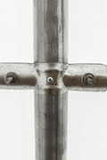 Connection detail of trussed steel tubing used in straight-wall steel buildings