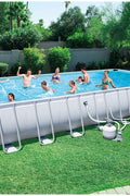 Family enjoying 31ft steel frame above ground swimming pool