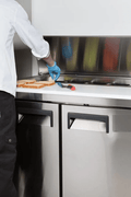 4ft stainless steel salad sandwich prep table with cutting board
Commercial prep table with refrigerated storage
Open sandwich station showing interior shelves and pans