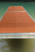 Complete aluminum dock system with wood grain vinyl decking
4x10 FT aluminum dock section by water
Aluminum dock kit with base plates and auger ends
Lakefront dock system installation with ramp connector