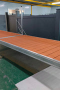 Complete aluminum dock system with wood grain vinyl decking
4x10 FT aluminum dock section by water
Aluminum dock kit with base plates and auger ends
Lakefront dock system installation with ramp connector