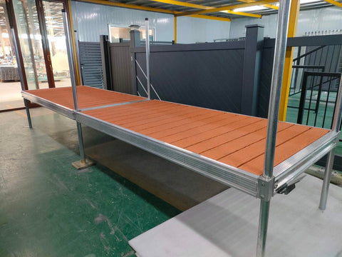 Complete aluminum dock system with wood grain vinyl decking
4x10 FT aluminum dock section by water
Aluminum dock kit with base plates and auger ends
Lakefront dock system installation with ramp connector