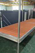 Complete aluminum dock system with wood grain vinyl decking
4x10 FT aluminum dock section by water
Aluminum dock kit with base plates and auger ends
Lakefront dock system installation with ramp connector