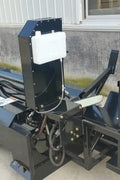 Skid steer firewood processor with 45-ton splitter attached
Log splitter with Stihl saw mounting plate
Firewood processing log cradle and splitting wedge
Heavy-duty 45-ton log processor on worksite
Operator splitting wood from skid steer seat