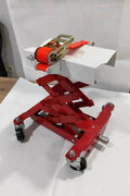 “450 lb red low lift transmission jack with swivel casters”

“Heavy-duty steel frame transmission jack under vehicle”

“Low-profile automotive transmission lift tool”