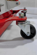 “450 lb red low lift transmission jack with swivel casters”

“Heavy-duty steel frame transmission jack under vehicle”

“Low-profile automotive transmission lift tool”