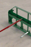 Heavy-duty green hay frame with bale spear for John Deere loader
John Deere-compatible bale spear attachment with headache rack
4500 LB hay spear frame with Conus 2 spear and fork slots