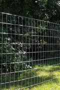 Wide shot of the 5 ft x 100 ft welded wire roll standing vertically

Close-up of 2x4 mesh pattern

Wire mesh showing galvanized finish detail

Fence installed along a garden perimeter