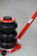 Triple Bag Pneumatic Air Jack – 5 Ton Capacity in Red and Black
5 Ton Air Jack – Top View Showing Triple Airbags and Base
Adjustable Handle Pneumatic Air Jack – Folded Position for Storage
Heavy-Duty Air Jack – Full Setup with Hose and Handle
Triple Air Bag Jack in Use – Lifting a Vehicle