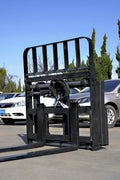 Side view of 5000 lb side shift pallet forks for skid steer

Heavy-duty hydraulic pallet fork with side shift mechanism

Pallet fork attachment mounted on forklift outdoors

Black steel frame skid steer pallet forks with side shift

Industrial pallet forks for warehouse and yard use