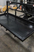6 FT carry all platform for tractors – 3-point hitch rear attachment
Rear view of black steel tractor carry platform with diamond plate deck
Close-up of pallet fork-compatible blade pockets on tractor platform