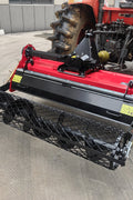 60” rotary stone burier tiller – 3-point hitch red attachment for tractors
Heavy-duty rock burying tiller with horizontal PTO offset system
Close-up of L-shaped blades and mesh roller on 60-inch tiller
PTO-driven stone burier tiller for compact tractors – SB165115