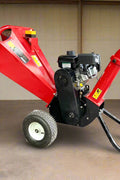 6.5 HP Wood Chipper with Briggs & Stratton engine – side view
Red GS100 wood chipper – front chute and wheels
Compact gasoline-powered wood chipper in garage setup
Rear view of GS100 chipper with large discharge chute