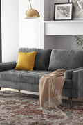 69.7-inch modern velvet sofa in navy blue with tufted back

Gray velvet upholstered sofa with pillows

Side view of modern green couch with wooden legs

Mid-century couch with tufted back and square arms