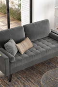 69.7-inch modern velvet sofa in navy blue with tufted back

Gray velvet upholstered sofa with pillows

Side view of modern green couch with wooden legs

Mid-century couch with tufted back and square arms